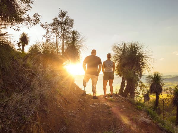 Two veterans hiking and watching the sunrise
